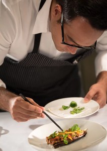 pic of man plating up trendy christmas food for guests christmas.co.uk