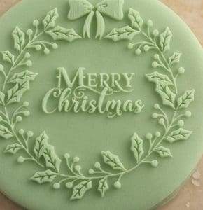 pic of a Christmas cookie with a decoration stamped on it - Christmas cookies - recipes and the history